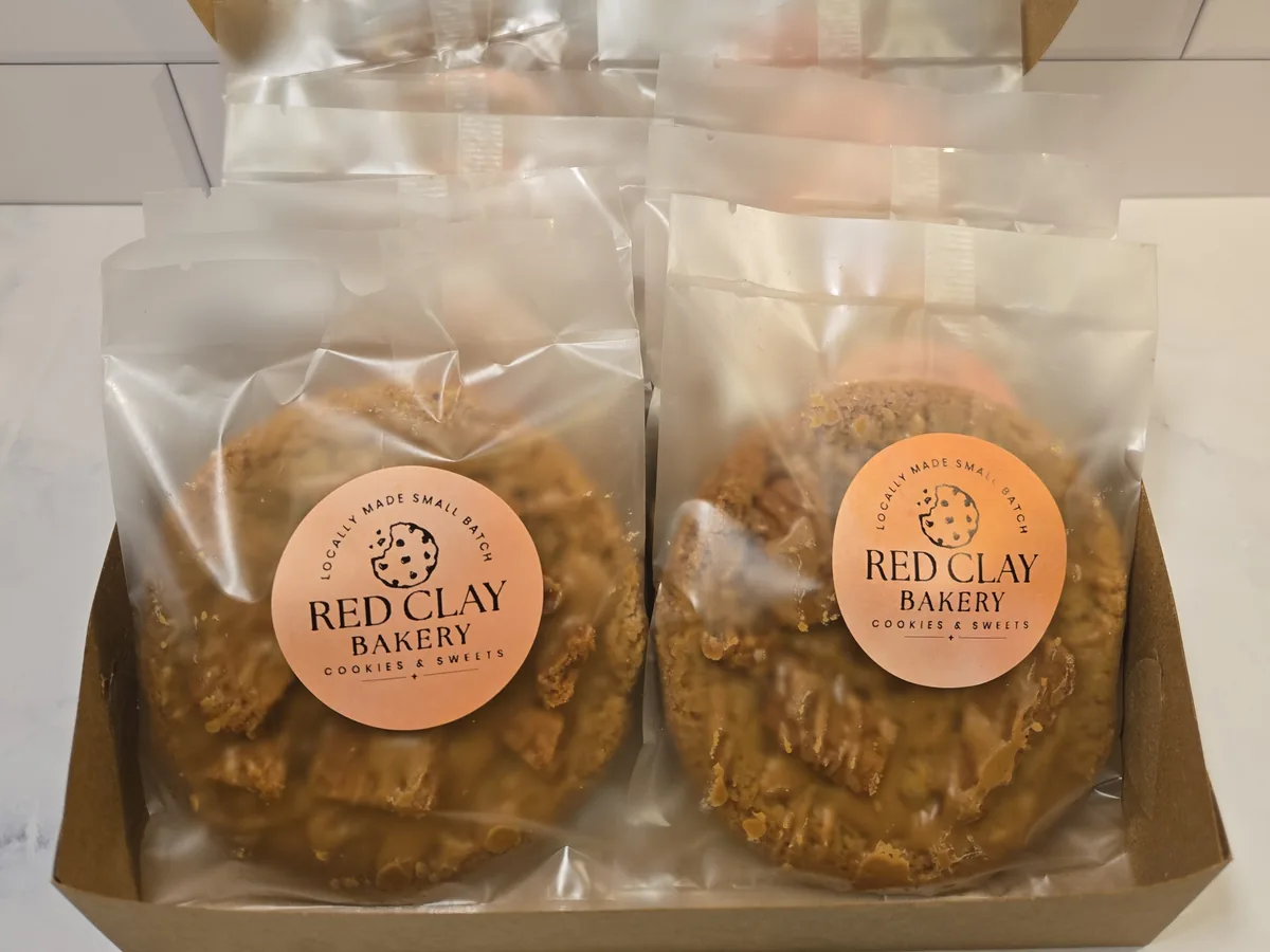 Individually wrapped Red Clay Bakery cookies in a gift box